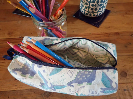 Trousse en tissu motif dinosaures