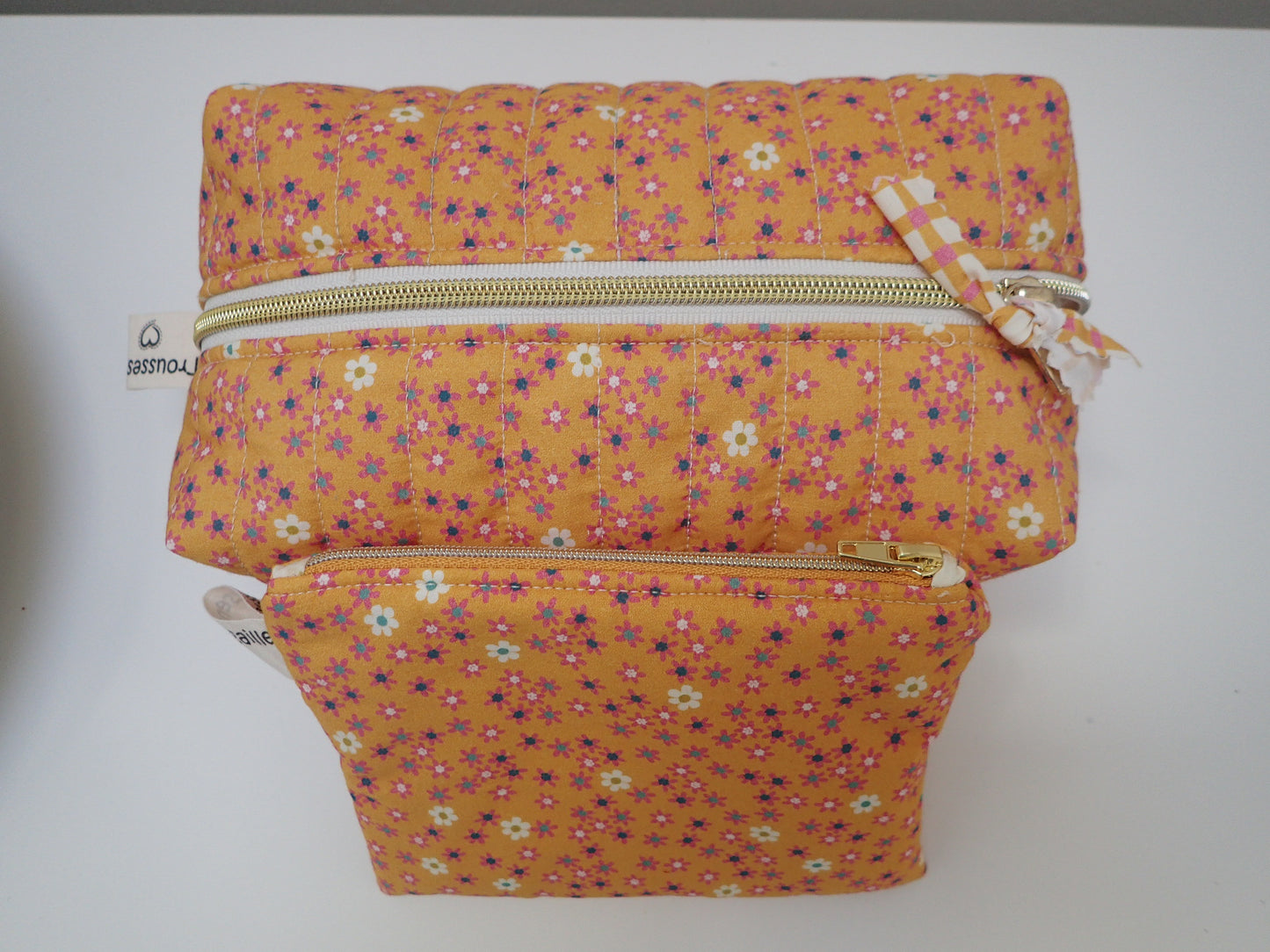 Trousse de toilette et sa pochette assortie